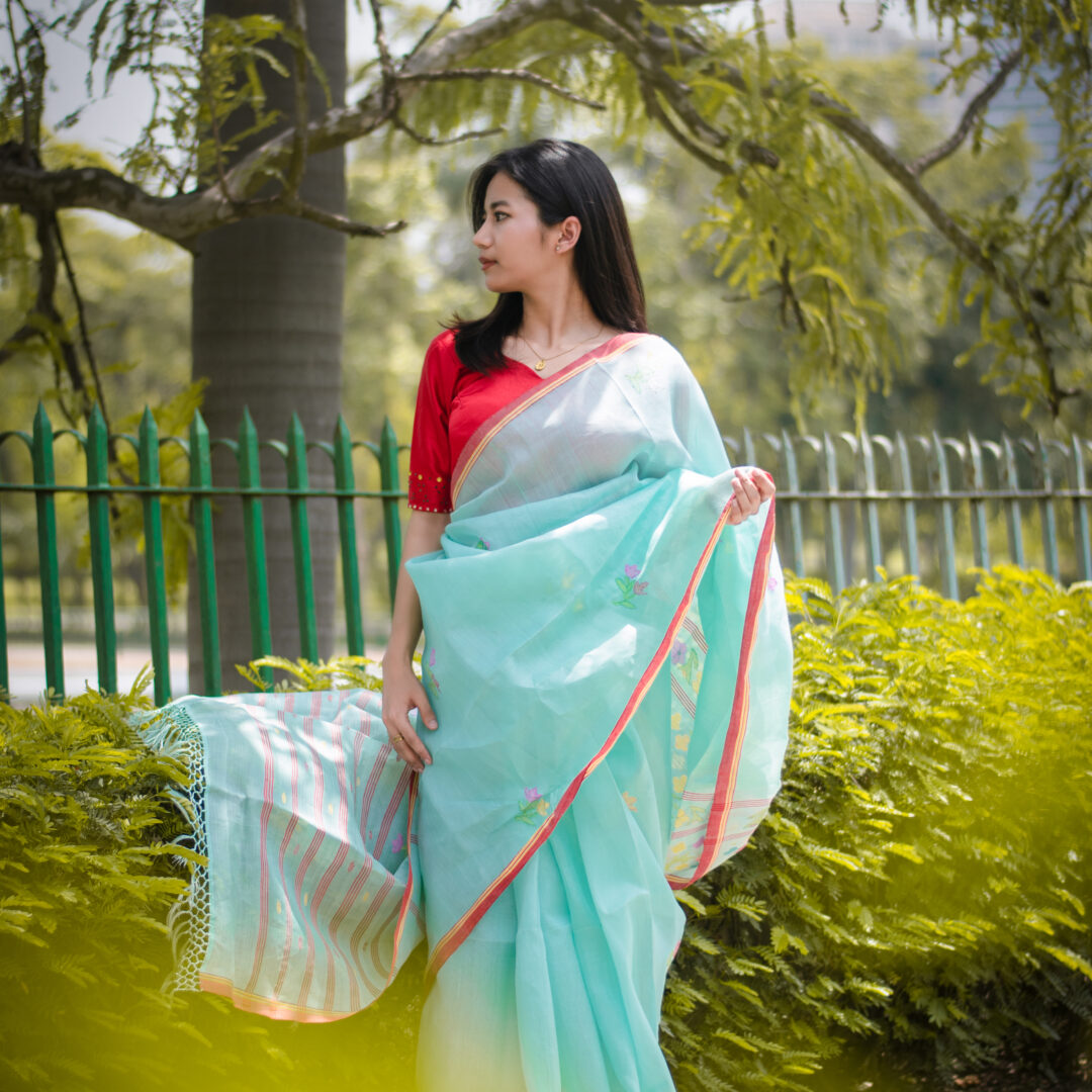 Icy Aqua blue colour saree with red border