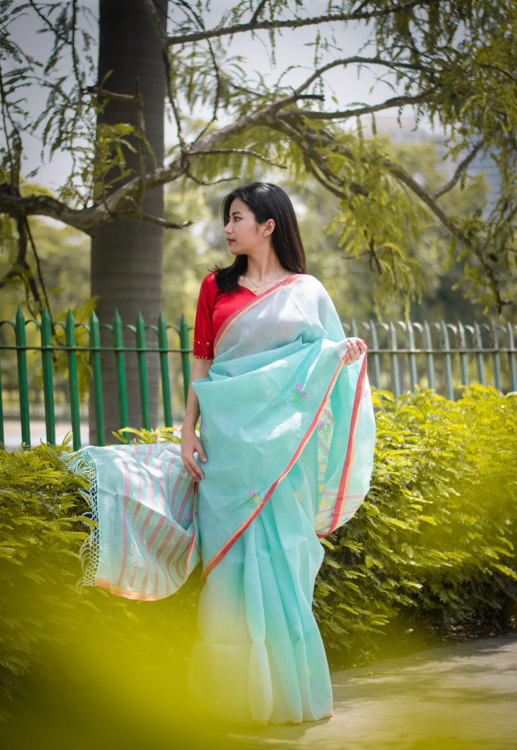 Icy Aqua blue colour saree with red border