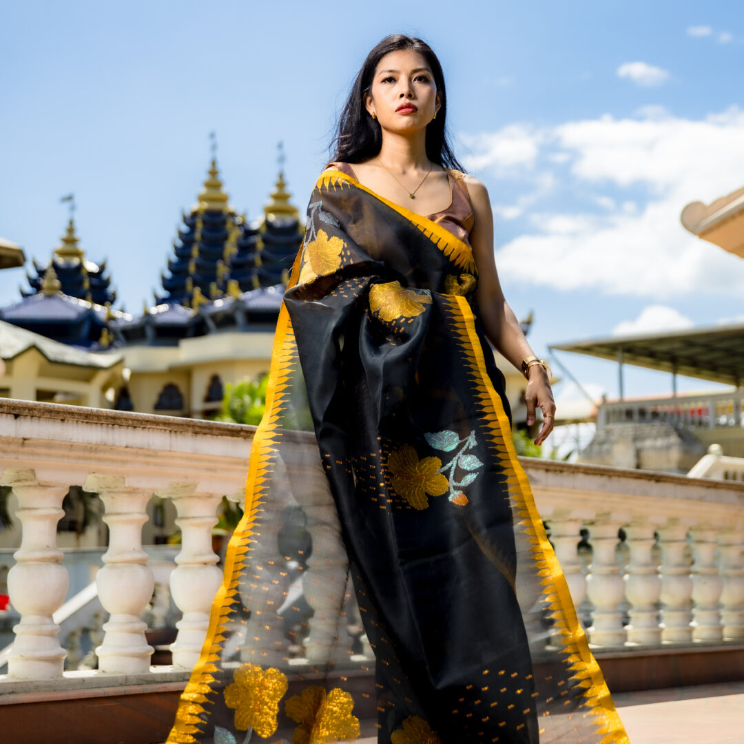 Charcoal Black Semi Raw Mulberry Silk Saree with Golden Moirangphee Border & Hibiscus Motifs