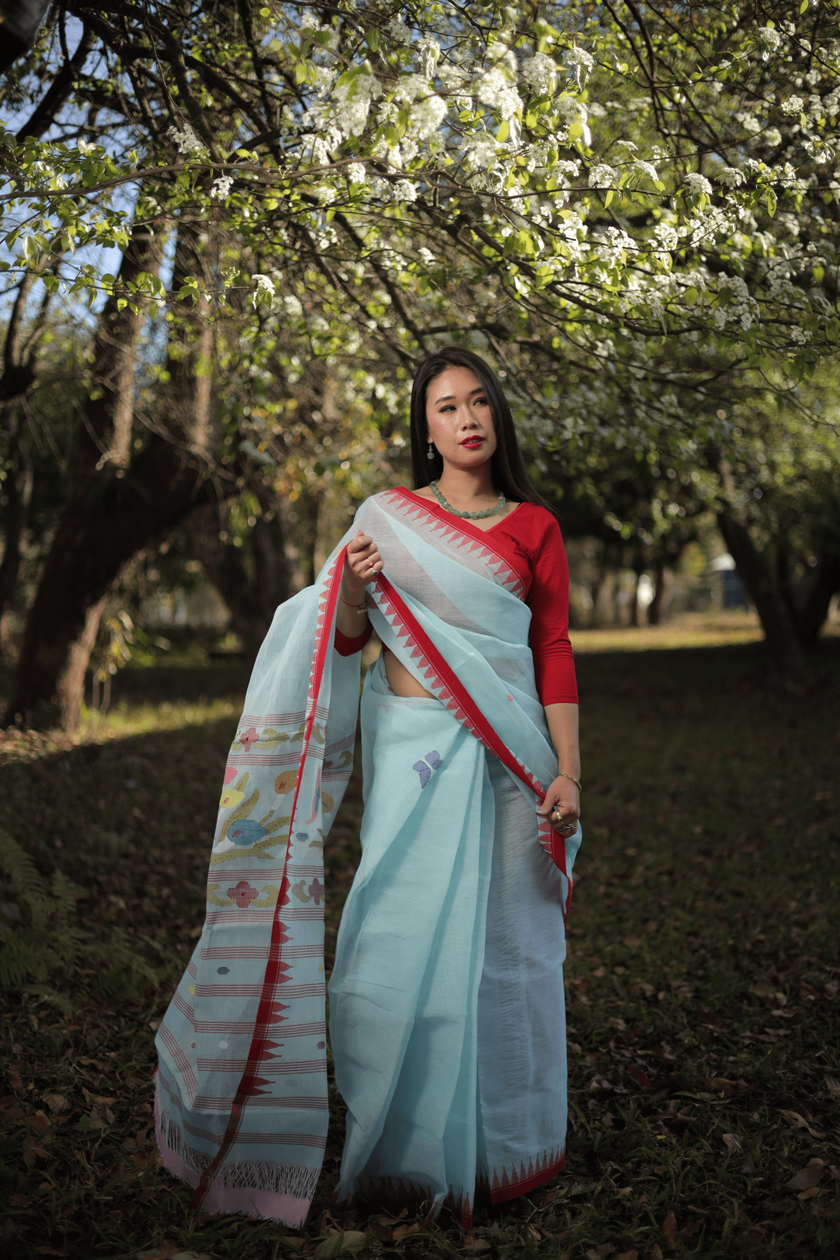 Ice Blue Handloom Cotton Saree with Vibrant Red Moirangphee Border - Image 2
