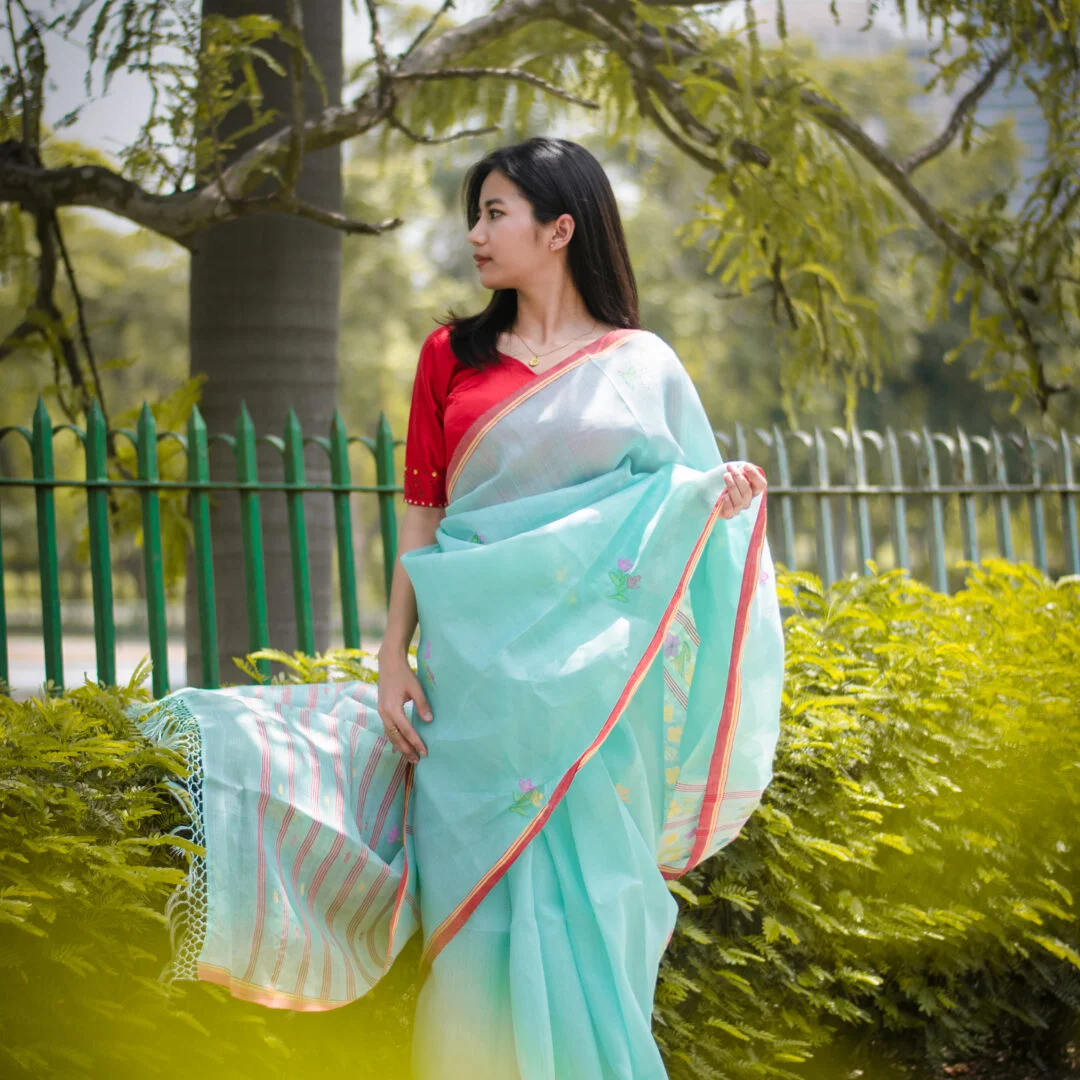Icy Aqua blue colour saree with red border